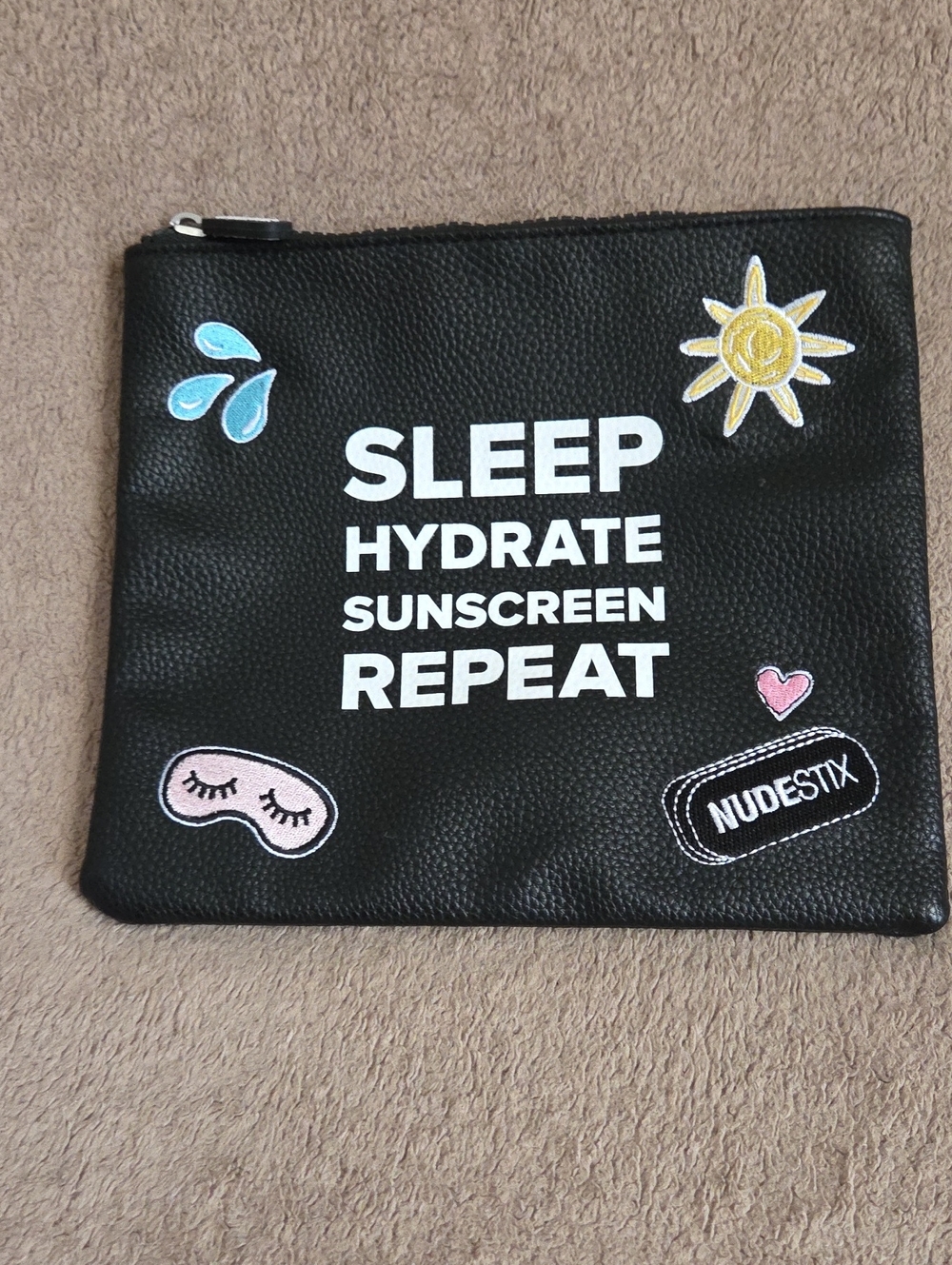 NUDESTIX Black Cosmetic Pouch with Playful Patches